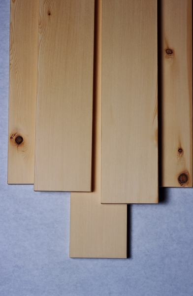 Several smooth finished yellow cedar (Chamaecyparis nootkatensis) dimensional lumber boards shown as examples