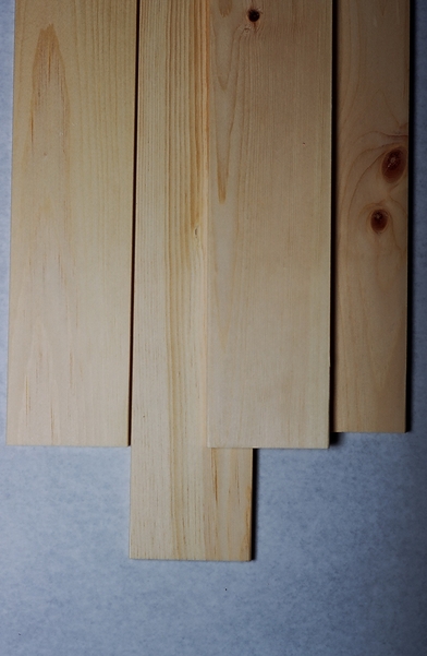 Several smooth finished western white pine (Pinus monticola) dimensional lumber boards shown as examples