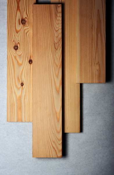 Several smooth finished western larch (Larix occidentalis) dimensional lumber boards shown as examples