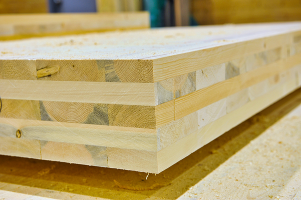 A mass timber product, specifically Cross-laminated timber (CLT), is shown here in close up during manufacture.