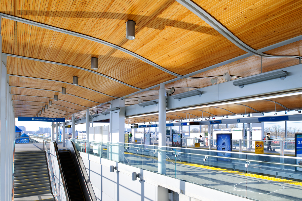Aberdeen Canada Line Station interior with wood detail ceiling in daytime