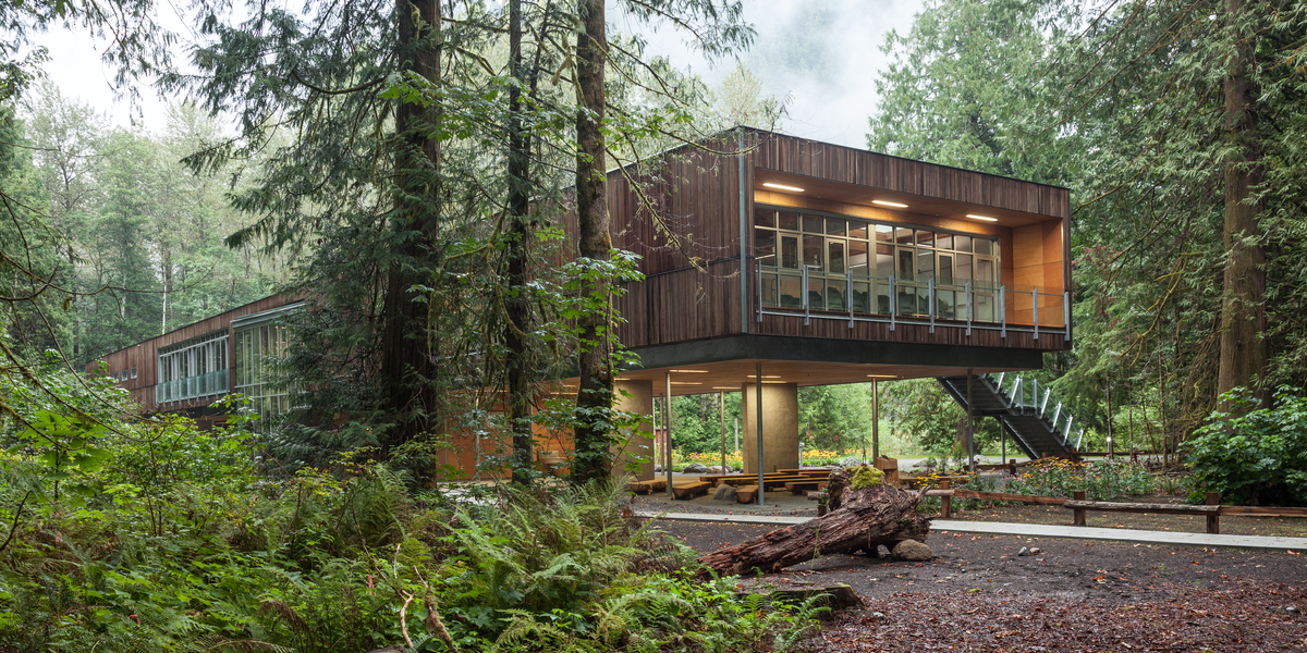 Cross-laminated timber (CLT), Glue-laminated timber (Glulam), and decorative Siding bring the elevated treehouse design of the Cheakamus Centre Blueshore Environmental Learning Centre to life
