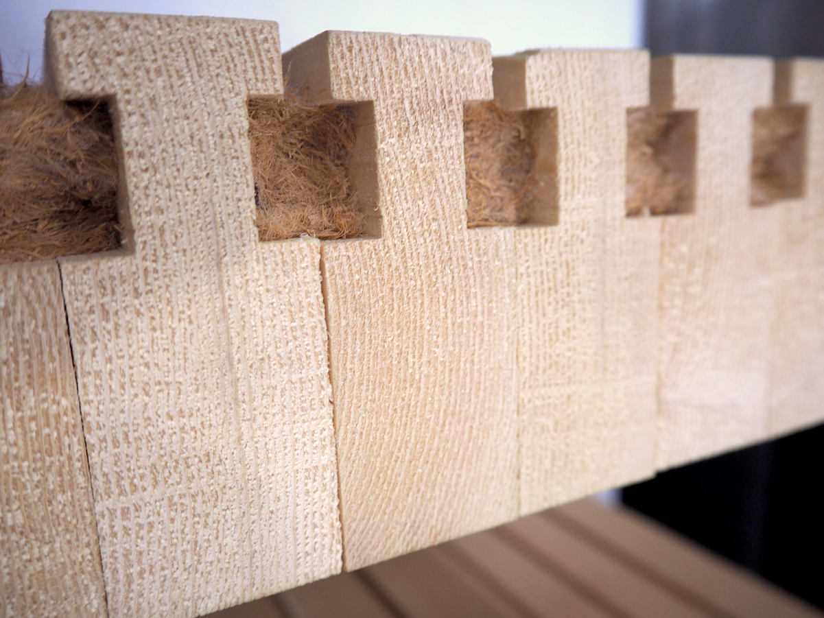 Close up image of dowel laminated timber (DLT) showing individual elements within laminated timber