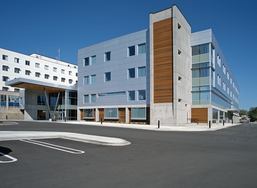 Prince George Hospital exterior showing wood detail on exterior of building with parking lot in foreground