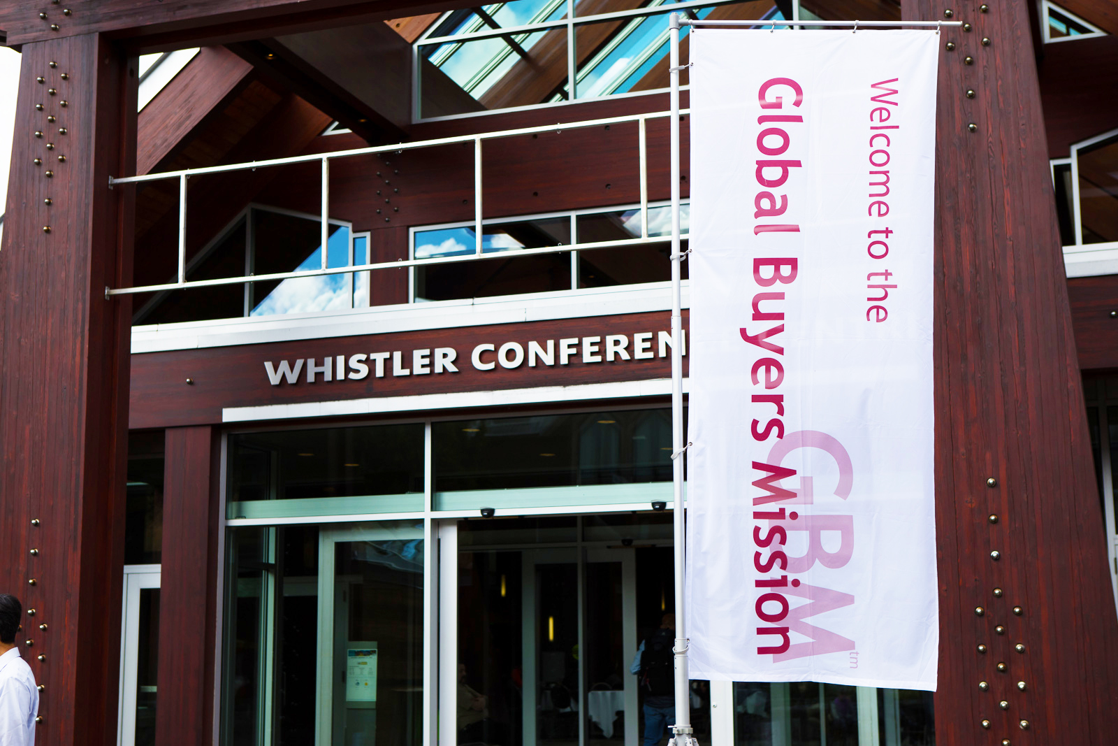 Facade of Whislter Conference Centre with a white vertical banner of the GBM 2016.