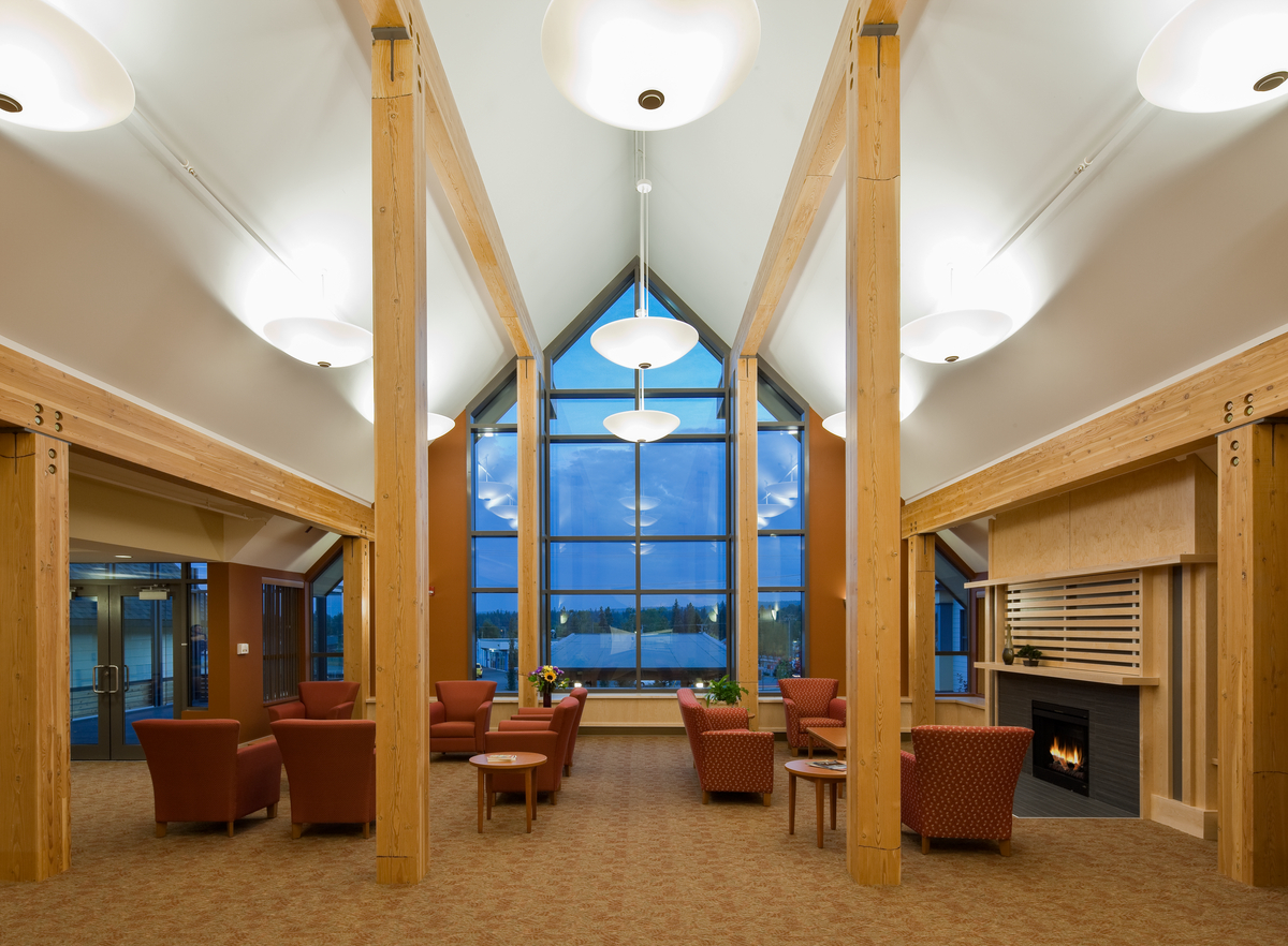 A selection of mass timber products, including glue-laminated timber (Glulam), are showing in this interior view of Gateway Lodge Long Term Care facility