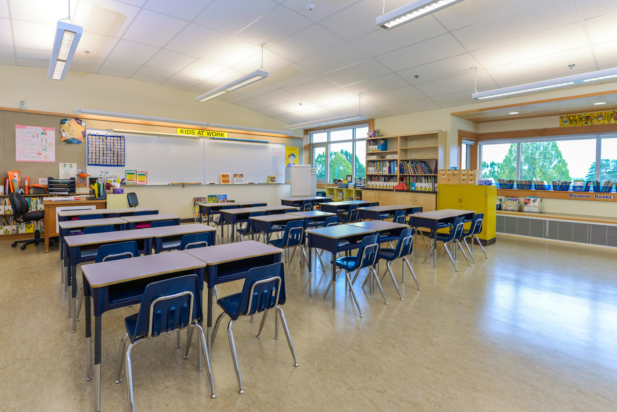 Indoor daytime view of low rise J.W. Sexsmith Elementary School classroom, showing the wood trim and accents