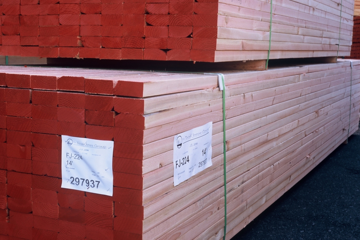 Close up image of banded and stacked dimension lumber, ready for transport