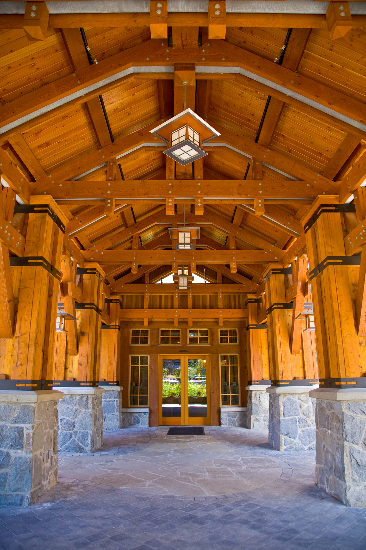 Douglas–fir was used to create the heavy timber post & beam and wood-steel composite construction shown here as part of the exterior entryway to the Nita Lake Lodge