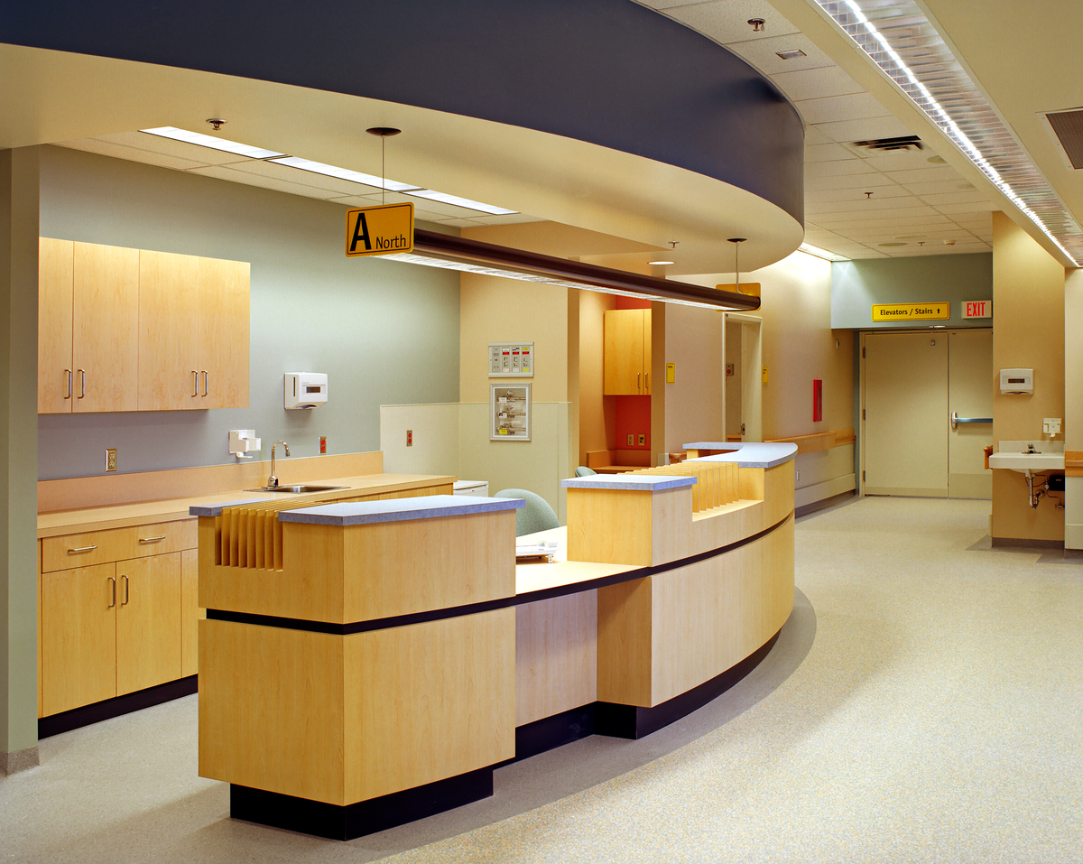 Douglas-fir veneer acoustic panels and department desks are shown in this interior image of the University Hospital of Northern British Columbia