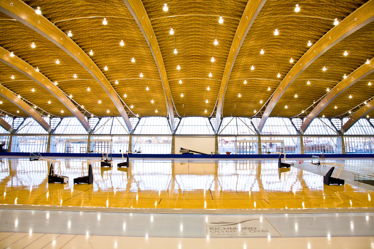 Glue-laminated timber (Glulam), solid-sawn heavy timbers, and wooden accents are featured in this vibrant interior view of the 33,750 square meter Richmond Olympic Oval