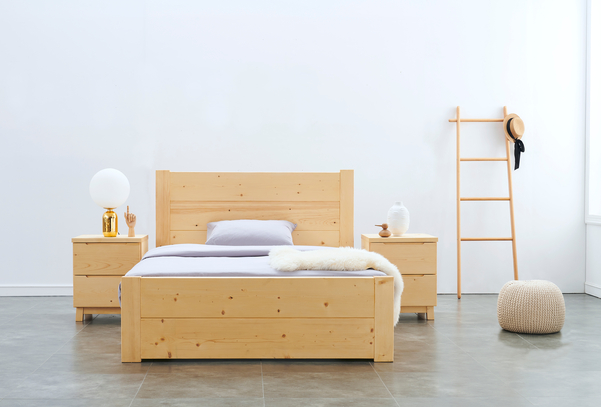 Warm golden brown wooden bedroom set made from White Spruce (Picea glauca) And Englemann Spruce (Picea engelmannii) in room with white walls and accessories