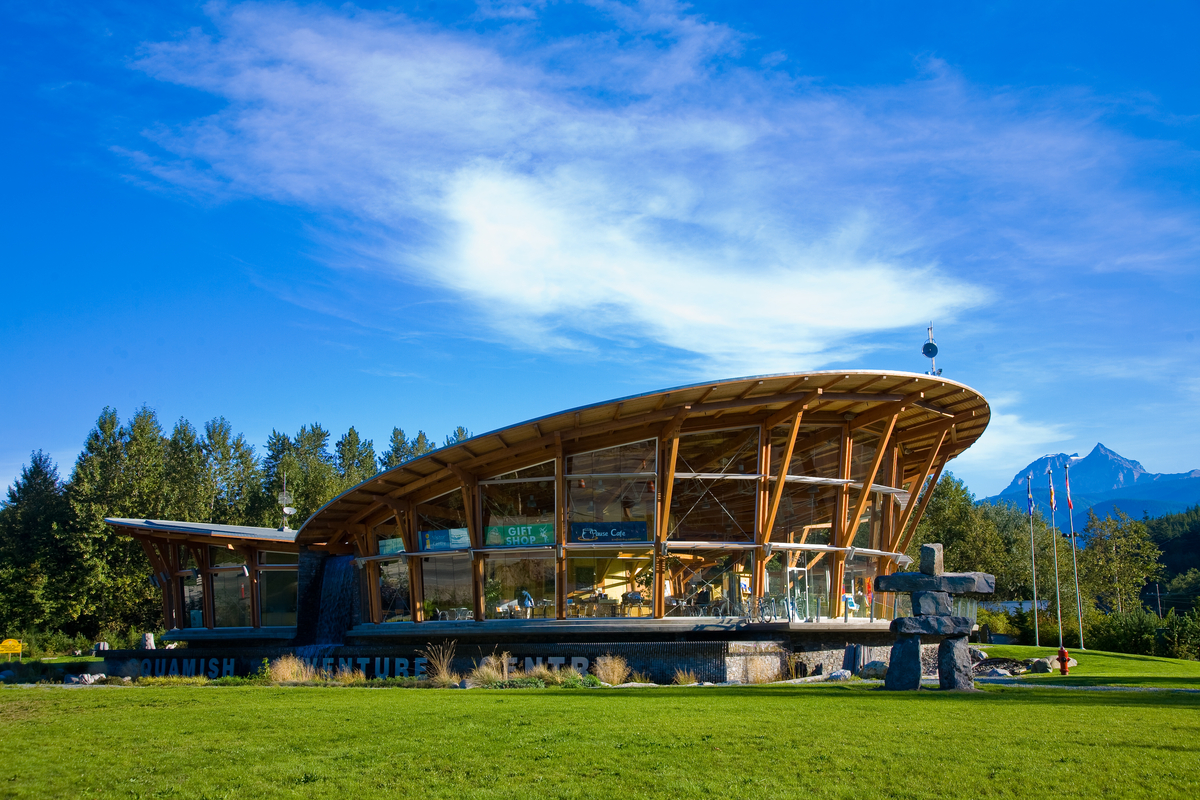 Exterior view of Squamish Adventure Centre showing building’s signature curved wing-like roof represents the eagles in the Squamish Valley