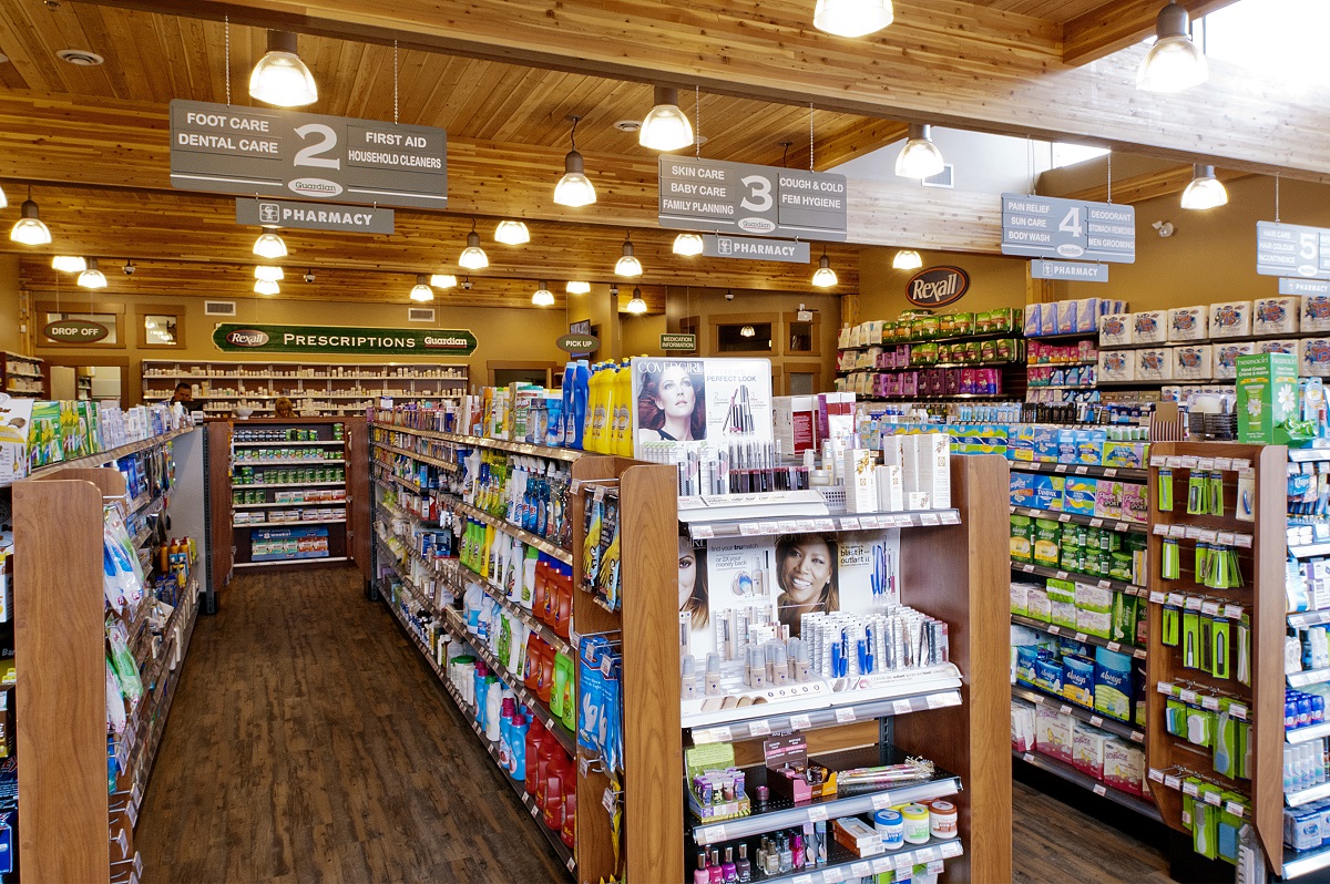 Interior sunny view of Suncoast Pharmacy highlighting mass timber and light frame elements, including glue-laminated timber (Glulam), post + beam, millwork, siding, and solid-sawn heavy timbers