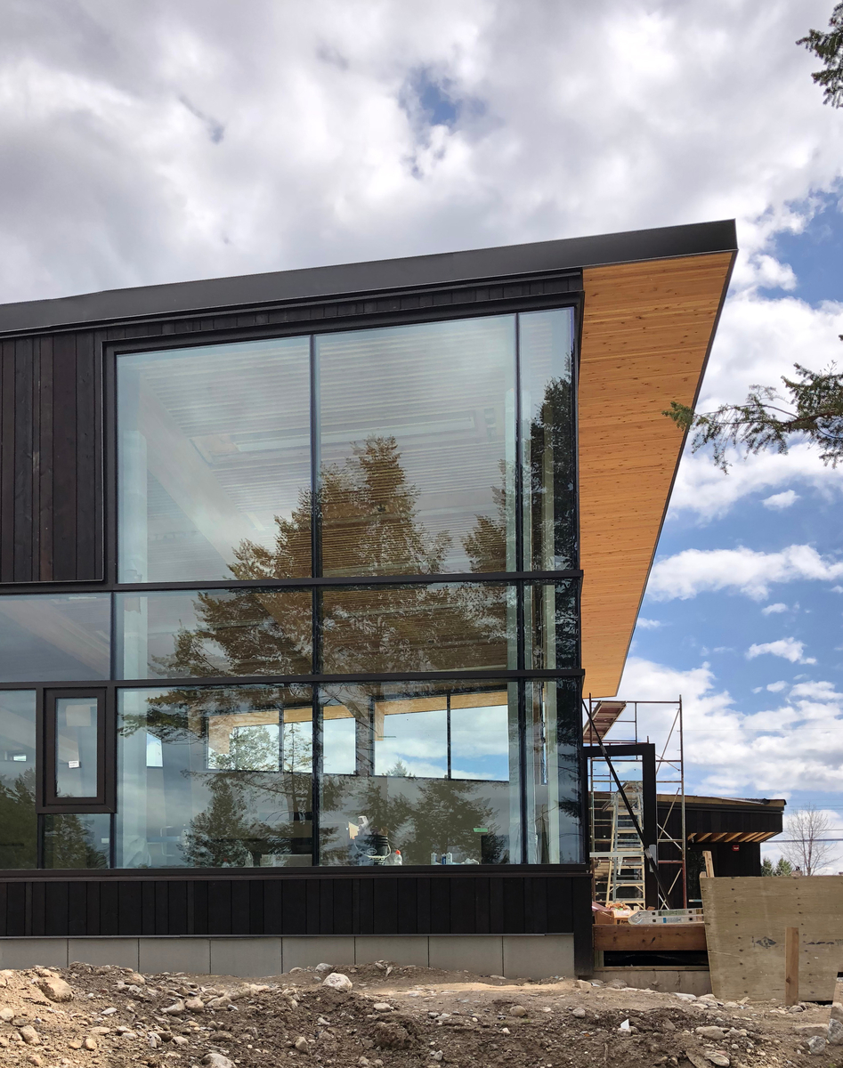 Exterior daytime view of Radium Hot Springs Community Hall and Library showing exterior roof overhang soffits of dowel laminated timber (DLT)