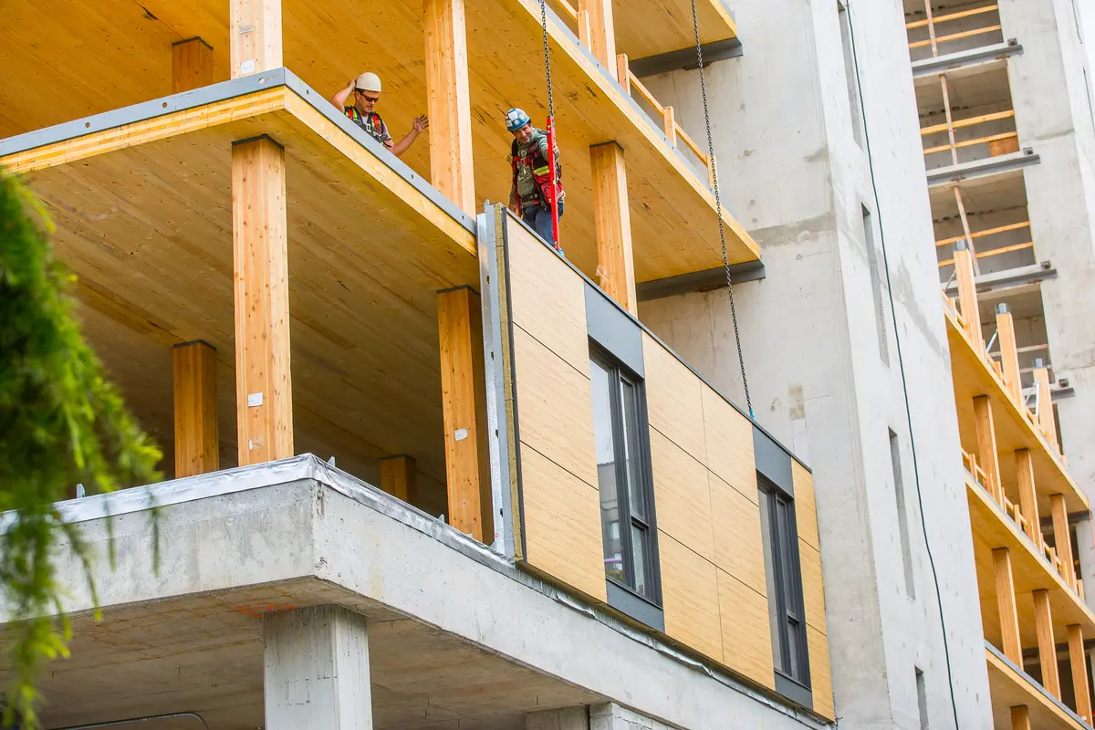 Exterior view of prefabricated panels being installed on mass timber constructed Brock Commons Tallwood House