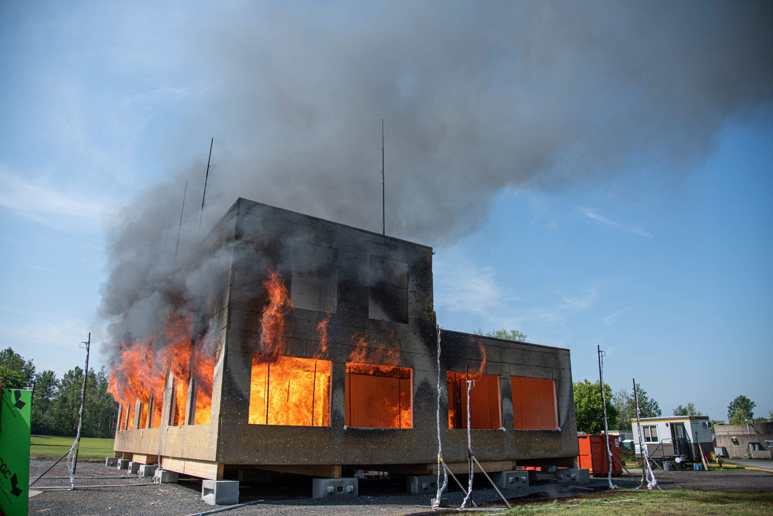 Mass timber building on fire as part of the Mass Timber Fire Demonstration Program.