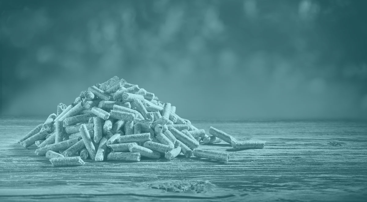 Small pile of wood pellets on wooden bench