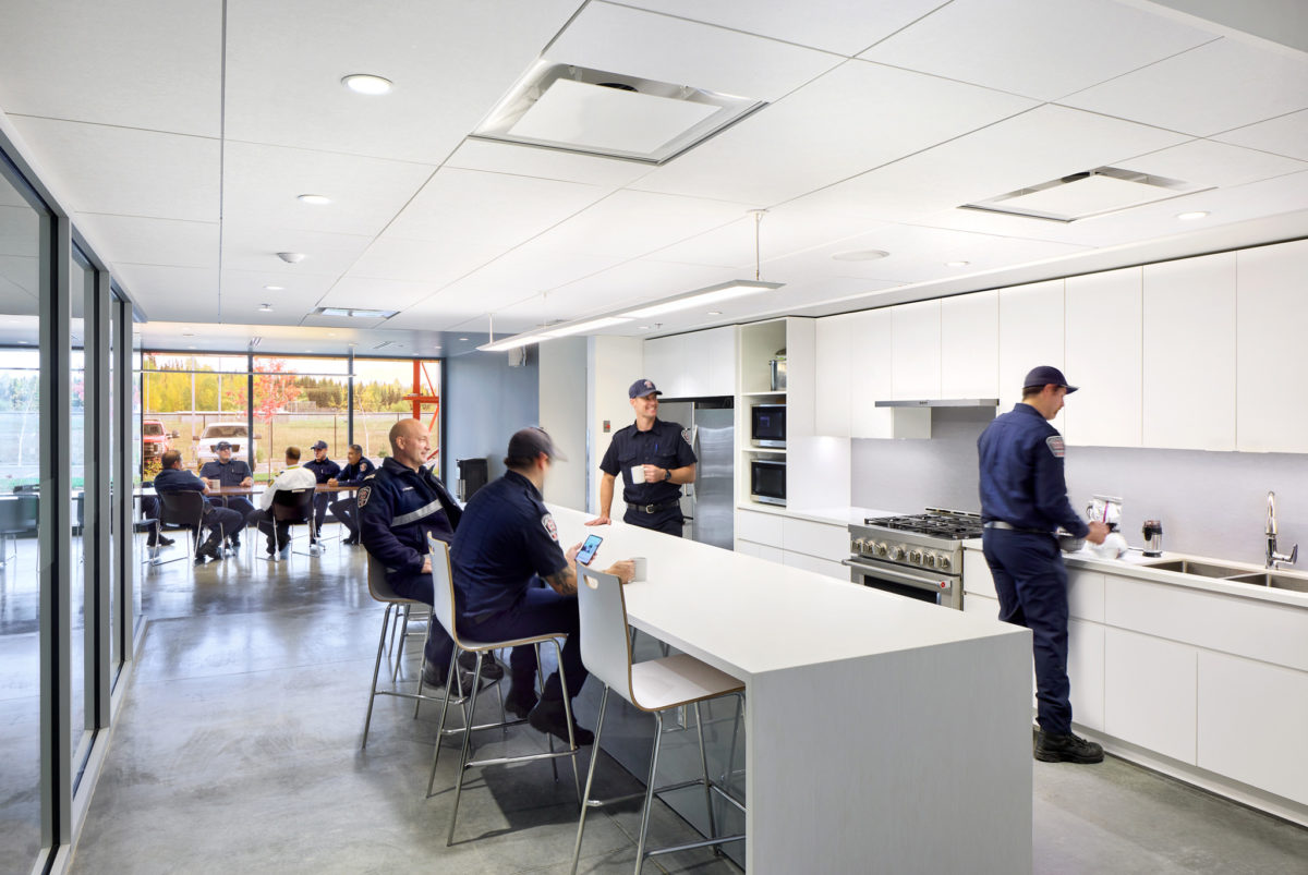 Kitchen area with people interacting and using the space
