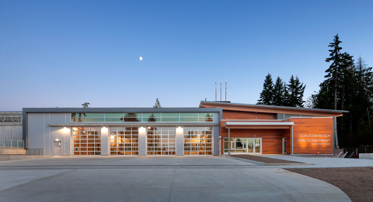 Exterior evening view of low rise light frame Qualicum Beach Fire Hall which included Laminated veneer lumber (LVL) and solid mass timber panels for construction